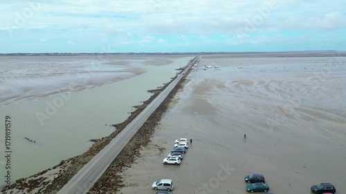 Aerial view of oyster farms at low tide near the Passage du Gois, Noirmoutier Island, France. Long rows of oyster beds and water channels create a unique landscape, showcasing traditional oyster
