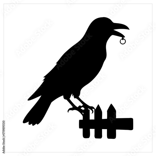 Silhouette of a crow perched on a fence holding a ring in its beak