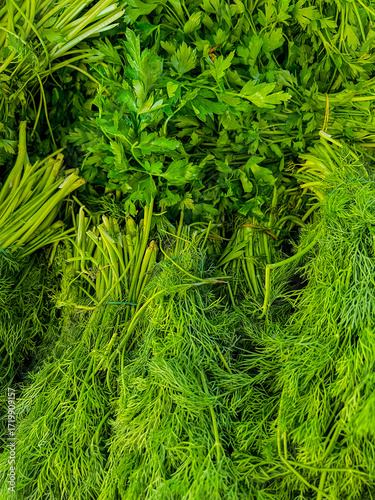 Fresh parsley bunches at street market stall