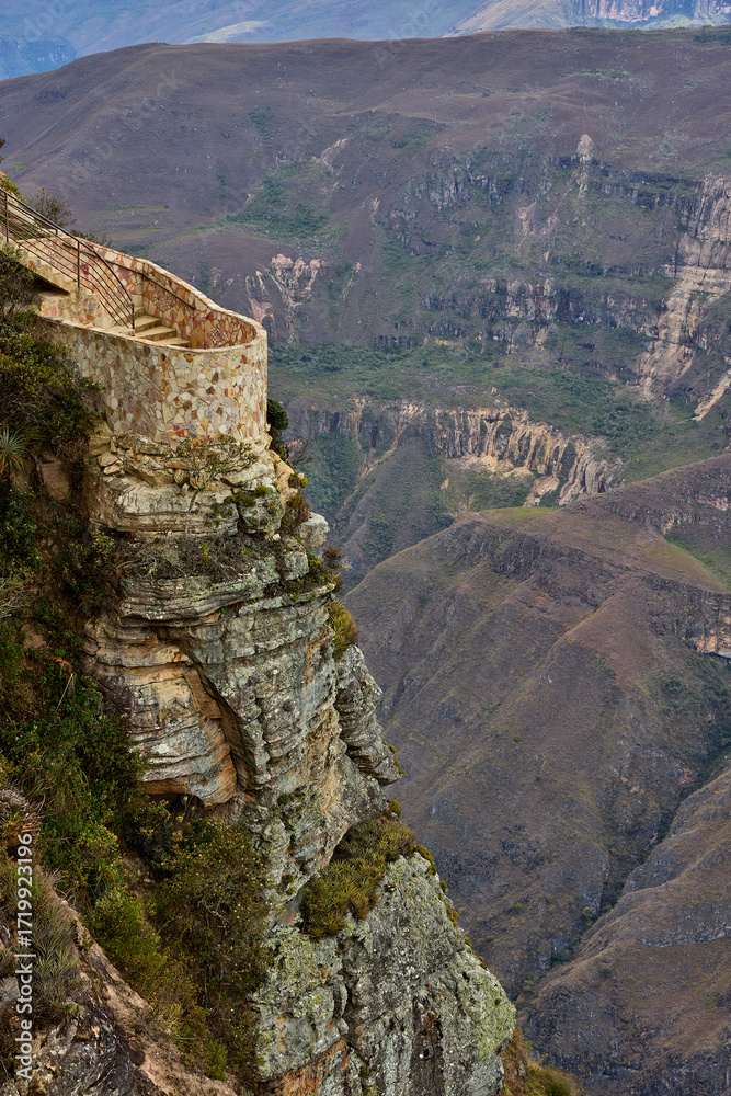 Naklejka premium From the Mirador de Huancas, the Sonche Canyon reveals its breathtaking depth and immensity. Sheer cliffs plunge into the valley below, while the vast Andean landscape stretches beyond