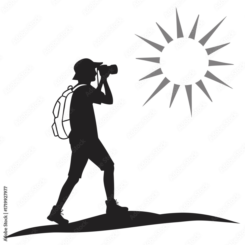 Fototapeta premium Hiker photographing sunrise silhouette