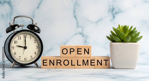 Open enrollment period reminder with vintage alarm clock and potted plant