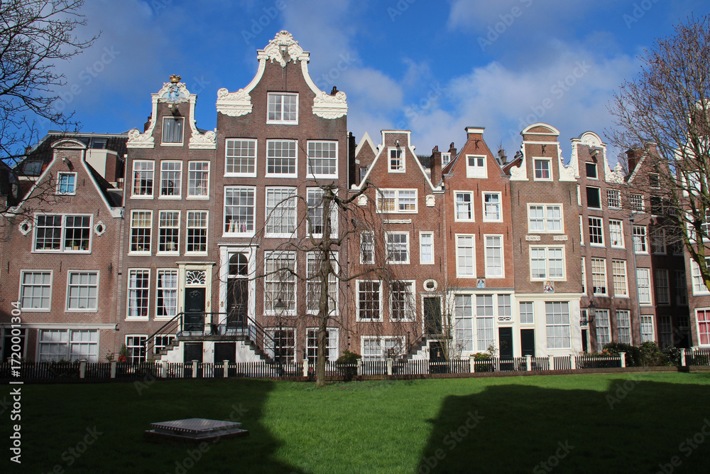 Fototapeta premium old brick habitation buildings (beguinage) in amsterdam in the netherlands 