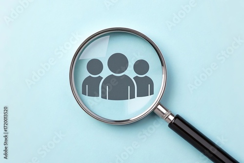 Magnifying glass focusing on people icons
