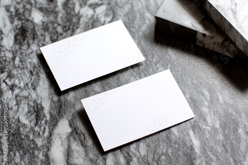 Blank White Business Cards on Marble Surface with Gift Box in Background