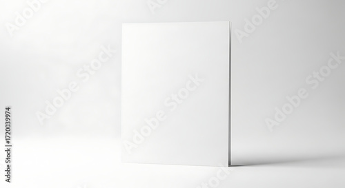 Blank White Vertical Card Standing Upright in a Minimalist Studio Setting