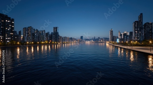 Wallpaper Mural Serene Cityscape at Dusk with Smooth Waters Reflecting Lights from Urban Skyline Torontodigital.ca