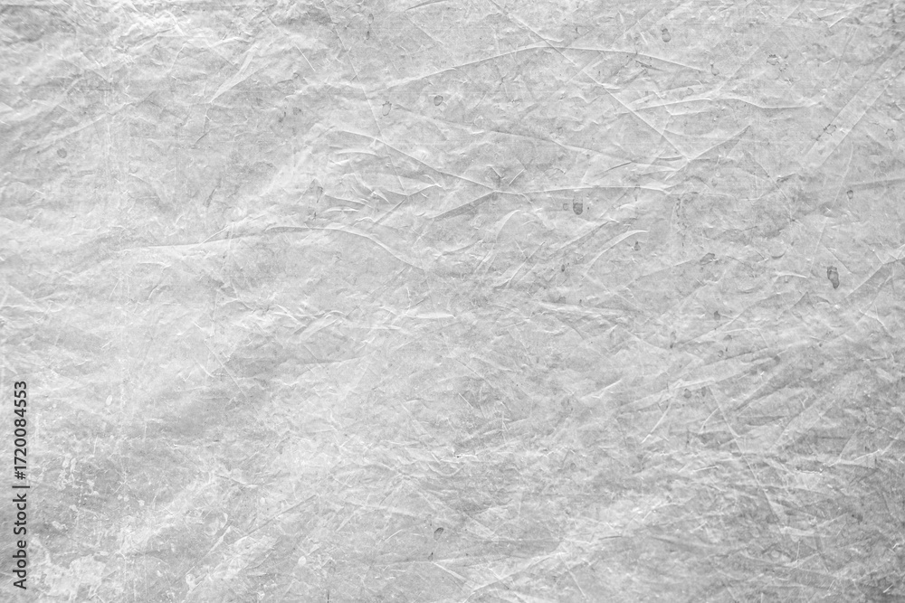 Naklejka premium wrinkled white paper texture, high-resolution background suitable for design mockups, overlays, and creative projects.