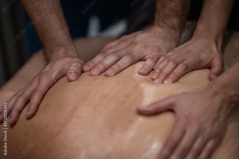 Fototapeta premium Therapeutic four hands massage for deep relaxation and healing