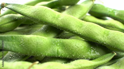 Close-up of fresh green beans covered in water droplets