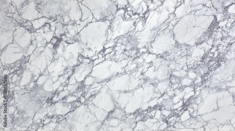 Obraz premium This marble surface displays a stunning array of light gray colors intertwined with darker veins. Ideal for countertops or flooring, it brings elegance to any space.