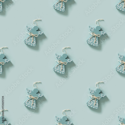 Фотография Seamless pattern of Christmas blue angels on blue background