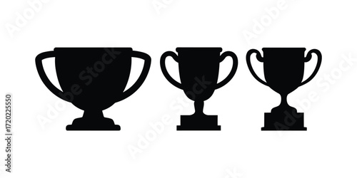 Three silhouetted trophies awarding victory and achievement