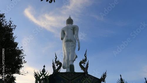Video background of Chonburi city viewpoint. At the Samnaksong Khao Phra Khru viewpoint in the Sri Racha Thailand,a beautiful Naga statue and a white Buddha statue stand tall among the mountains.