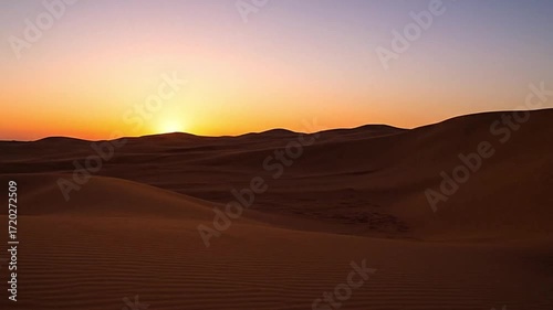 Sunlit Sand Dune Rising in Desert Landscape with Golden Hour Lighting and Wide Aerial Shot