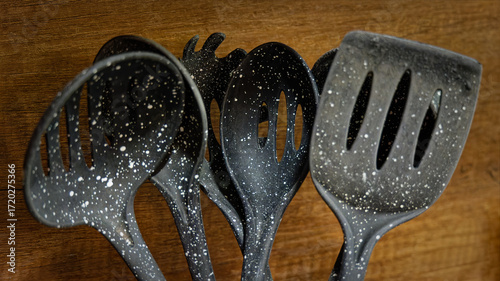 Used black with white dots plastic kitchen utensils