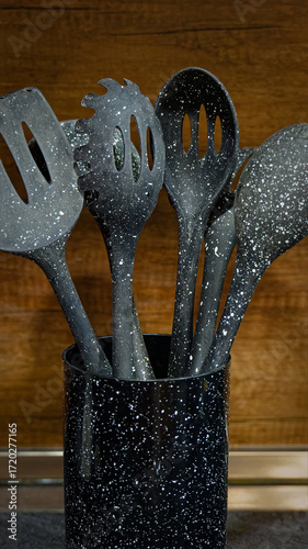 Used black with white dots plastic kitchen utensils
