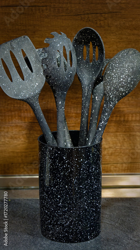 Used black with white dots plastic kitchen utensils