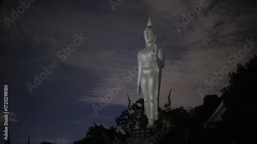 Video background of Chonburi city viewpoint. At the Samnaksong Khao Phra Khru viewpoint in the Sri Racha Thailand,a beautiful Naga statue and a white Buddha statue stand tall among the mountains.
