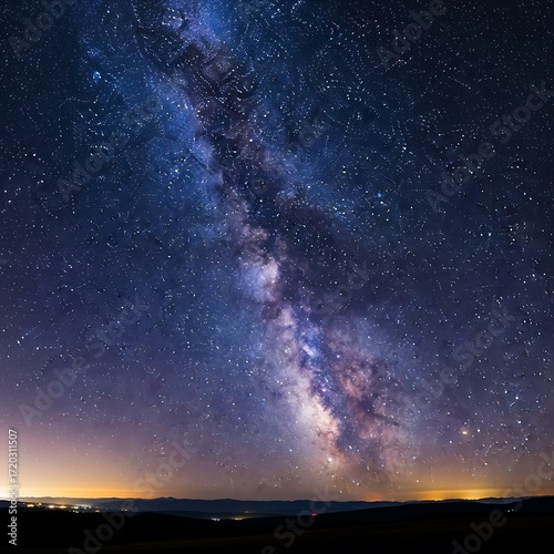 A magnificent celestial display showcases the Milky Way, vibrant hues, and countless stars across the night sky.