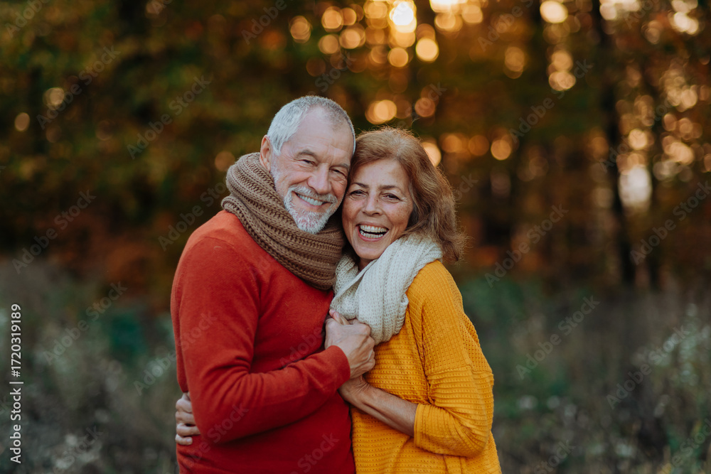 Fototapeta premium Portrait of senior couple in autumn nature.