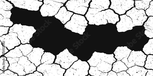 Cracked and textured dry old bark of a tree with a grunge pattern on the surface, resembling a map of the earth