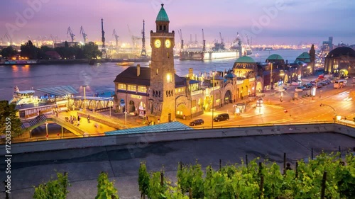 Illuminated hamburg landungsbrcken at dusk with people enjoying the view