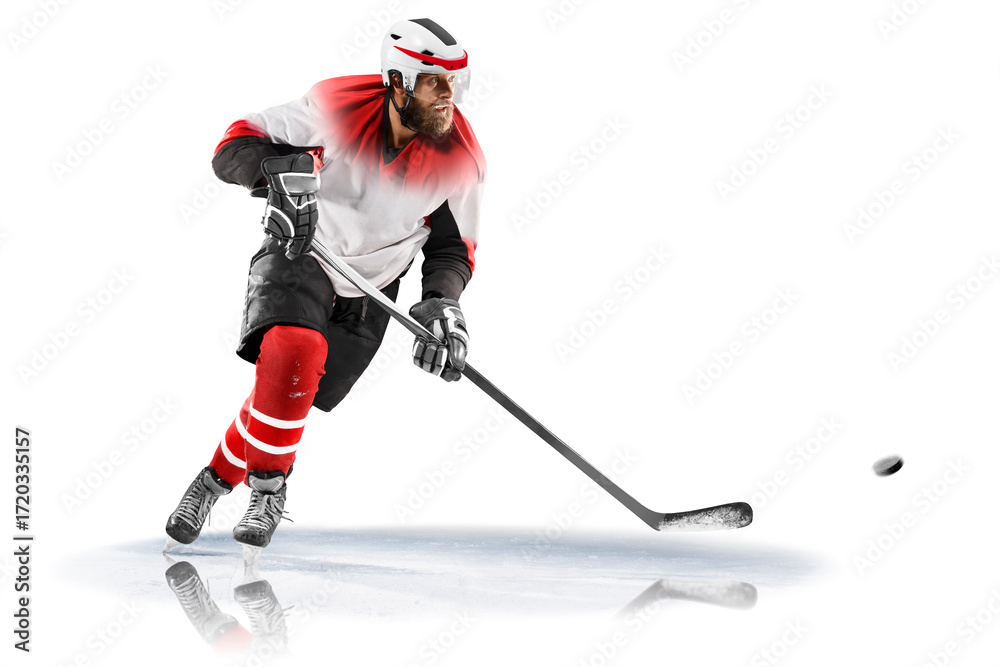 Obraz premium Isolated image on white. Professiona sport. Hockey. Professional ice hockey player on defending position on the rink. Hockey player in action