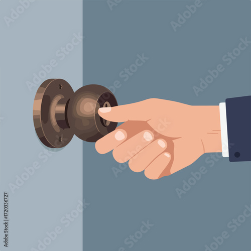 Hand turning a doorknob with a blue gray wall in the background