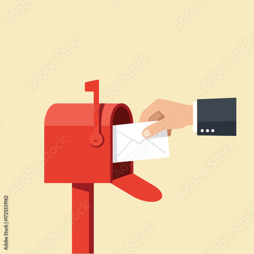 Hand placing white envelope into a red mailbox