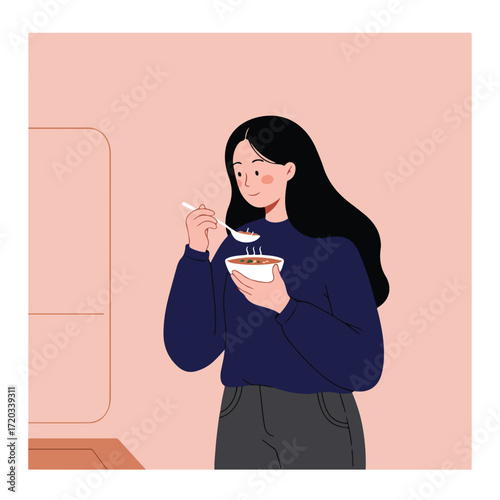 Young woman with black hair eats from bowl with spoon; peach background