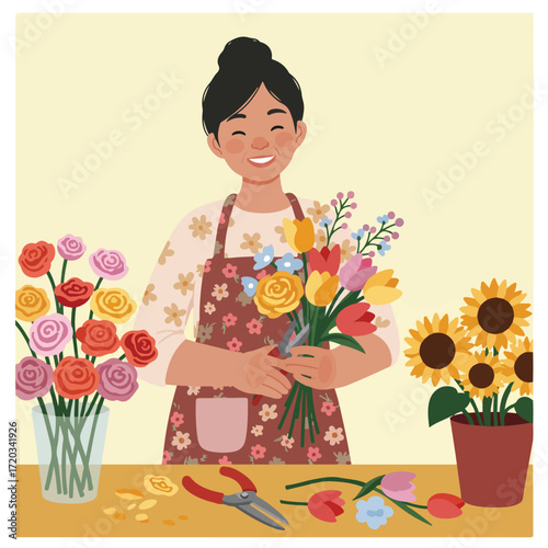 Woman arranging colorful flower bouquets with clippers at a table