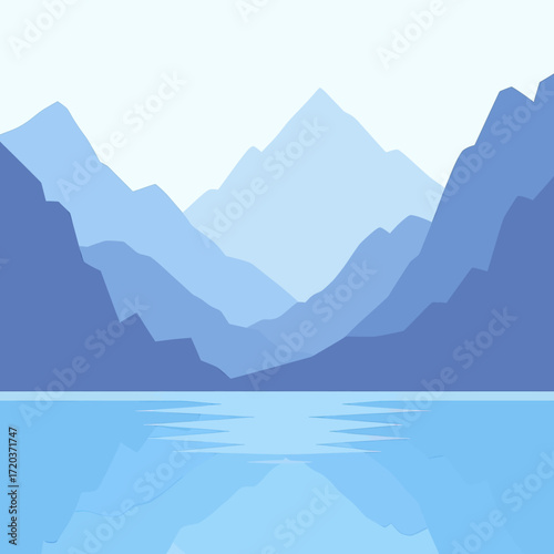 A serene landscape featuring a mountain range reflected in a calm body of water under a clear sky.