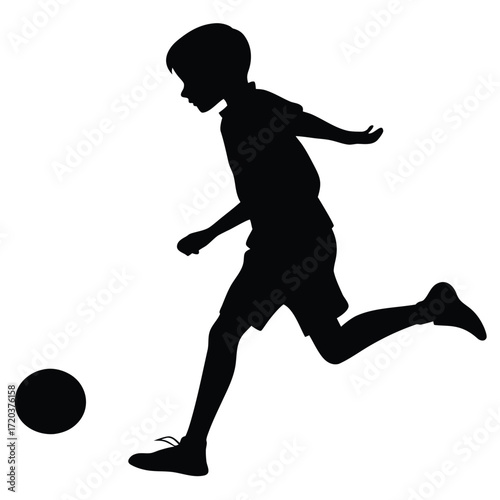 Boy kicking football silhouette