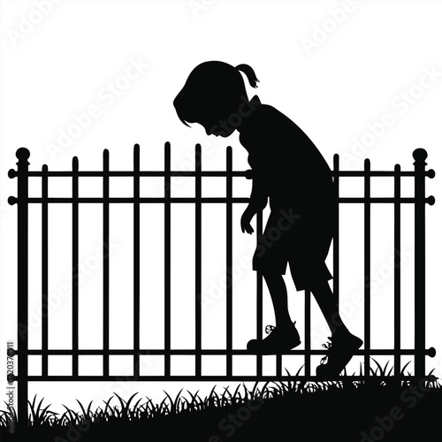 Child leaning over fence silhouette