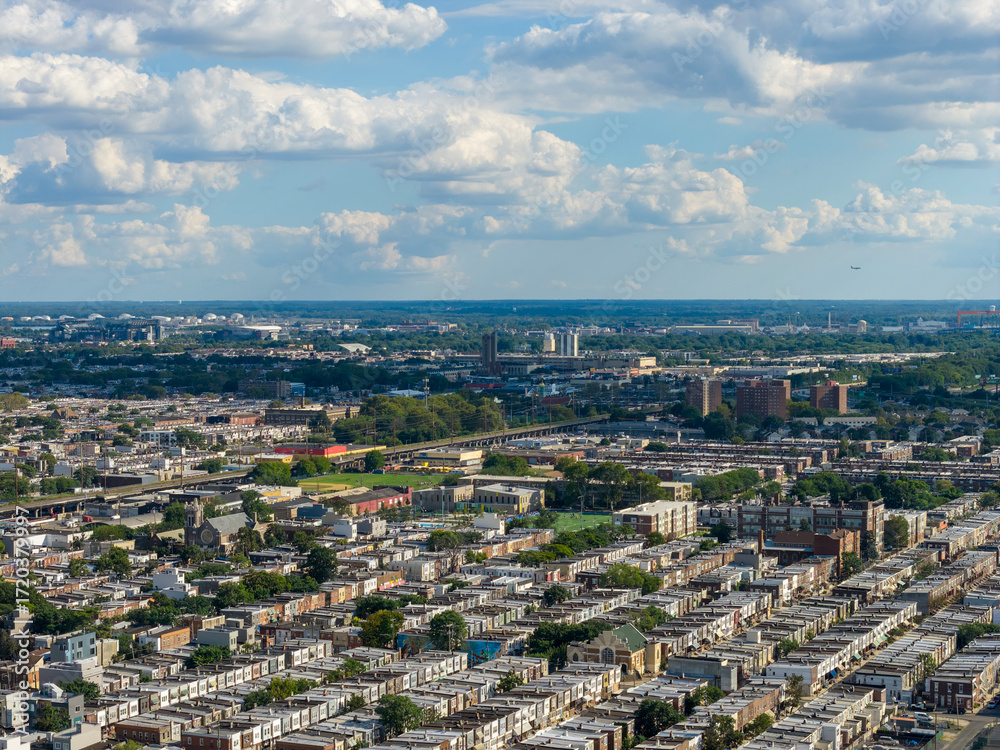 Naklejka premium Aerial shot of apartments, homes and office buildings in the skyline in Philadelphia Pennsylvania USA