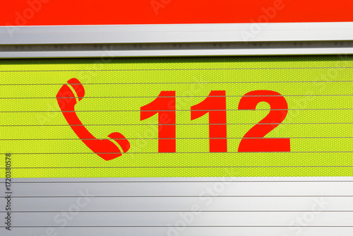 112 - European emergency telephone number. Detail on bright colorful surface.