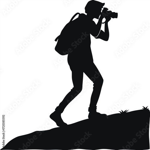 Photographer taking sunset photo silhouette