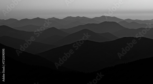 Dramatic layered mountain silhouettes at dusk evoke a sense of peace and adventure