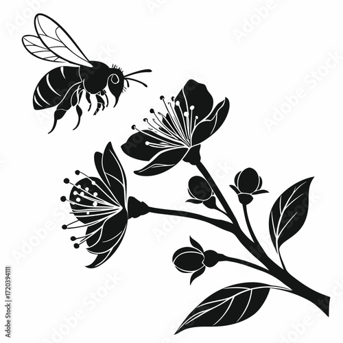 Bee hovering near blossom silhouette