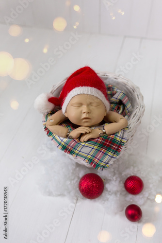 Christmas newborn baby mannequin in wicker basket