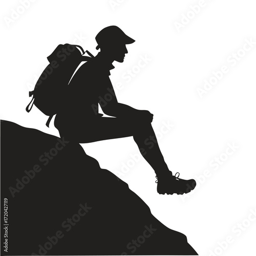 Hiker sitting on rock ledge silhouette