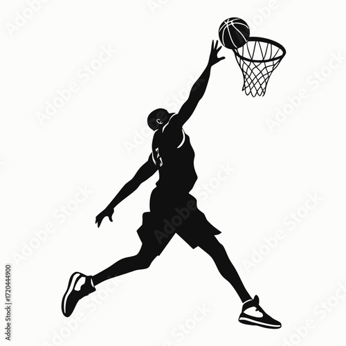 Basketball player doing slam dunk silhouette