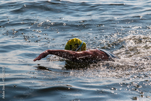Swimmer Practicing in Open Water During Bright Sunny Day