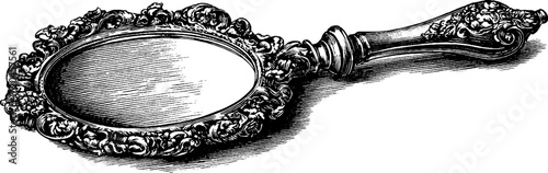 Ornate handheld mirror with vintage floral design
