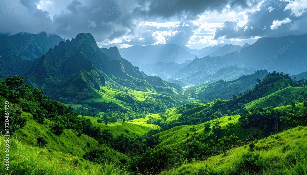 Fototapeta premium Lush Green Mountain Valley Under Dramatic Sky