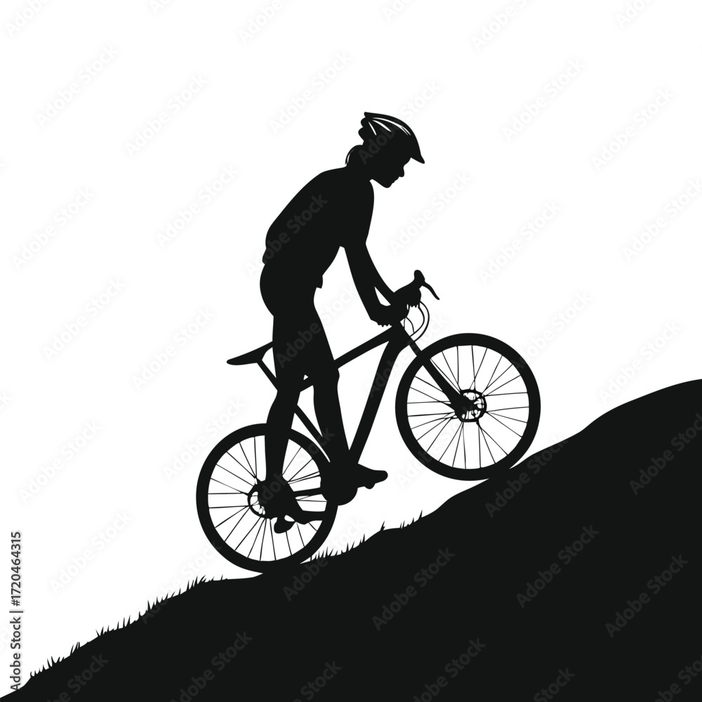 Fototapeta premium Cyclist standing on hilltop silhouette