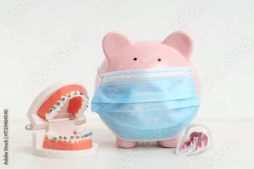 Piggy bank in mask and mode...