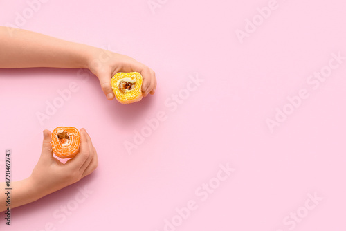 Child's hands with sweet Tu...