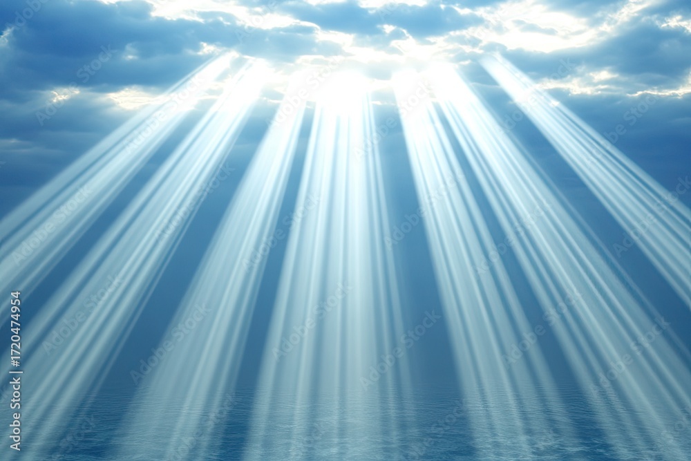 Fototapeta premium Sunlight beams through a cloudy sky